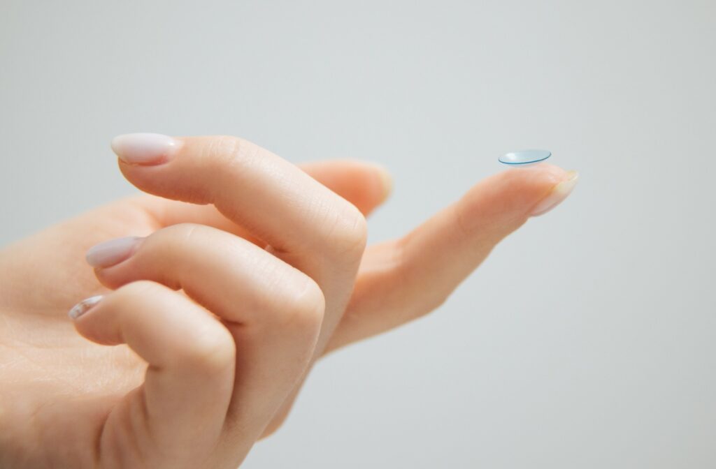 Contact lens balanced on a finger