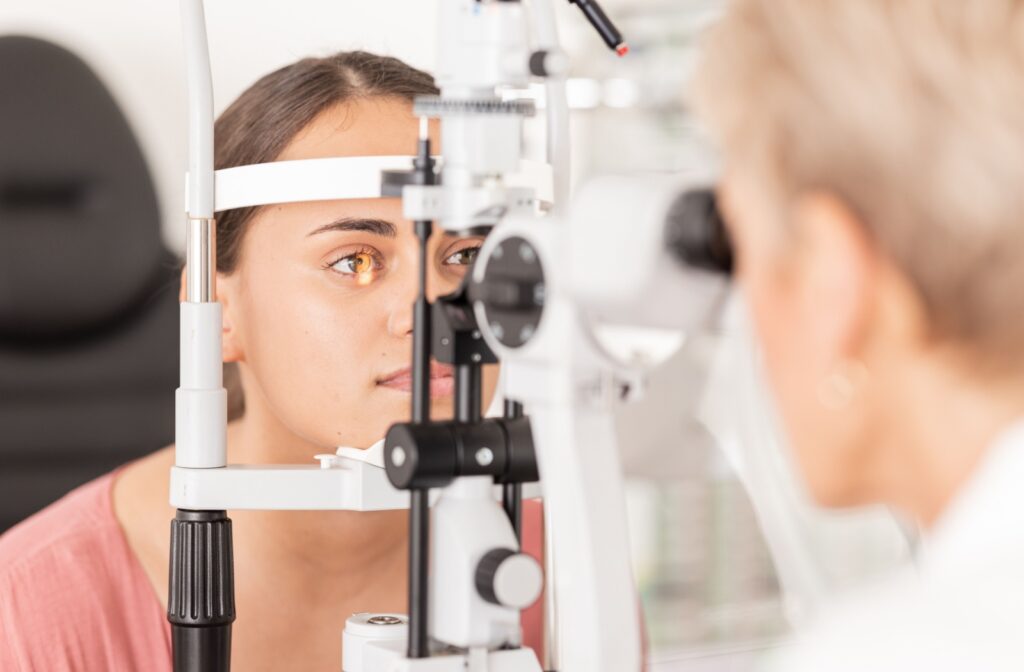 Patient receiving a comprehensive eye exam with no contact lenses in, preparing for accurate eye health assessment
